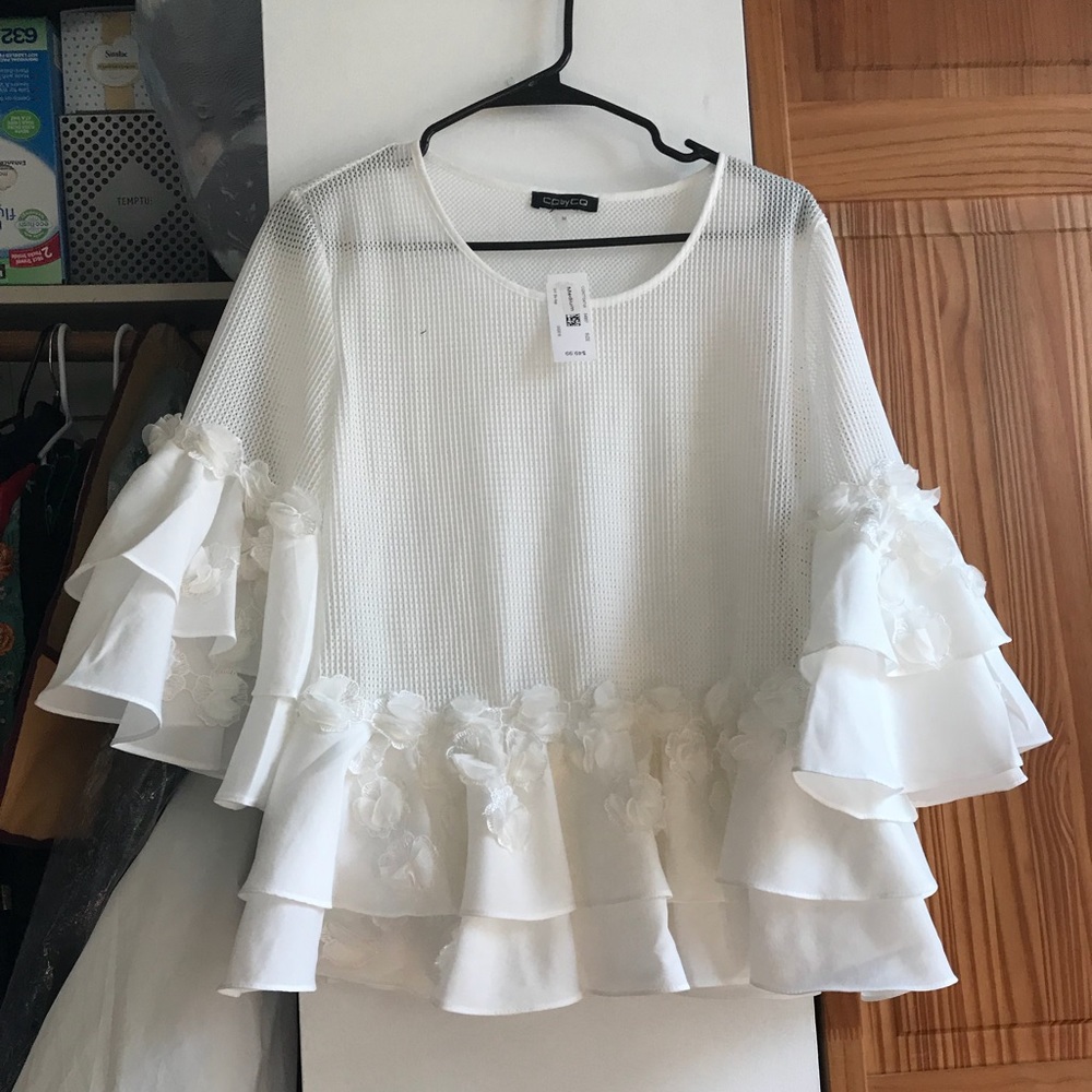 White ruffle blouse